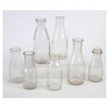 7 Northeast Embossed Round Milk Bottles