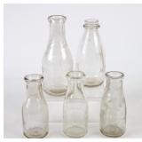 5 NC Embossed Round Milk Bottles