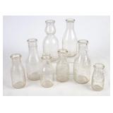 8 Embossed Round Milk Bottles