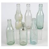 6 Embossed Green Glass Straight Side Bottles