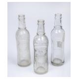 3 Budwine Clear Embossed Bottles