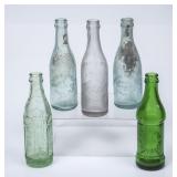 4 FL and 1 AL Embossed Straight Side Bottles