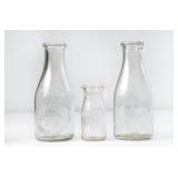 3 NC Embossed Round Clear Glass Milk Bottles