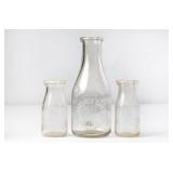 3 Fergusons Embossed Round Clear Milk Bottles
