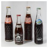4 Filled Soda Bottles