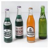 Lot of 4 10oz Soda Filled Bottles