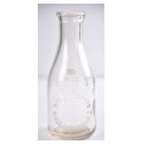 Mrs JT Simpson, NC Embossed Quart Milk Bottle