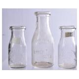 3 NC Embossed Round Milk Bottles