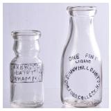 2 NC Embossed Round Clear Milk Bottles