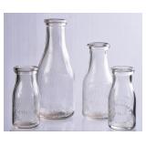 4 NC Embossed Round Clear Milk Bottles