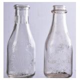 2 NC Embossed Round Clear Quart Milk Bottles