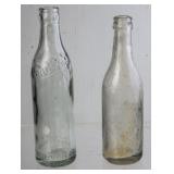 2 Embossed Straight Side Clear Glass Bottles