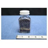 A Jar Of Polished Garnet Pieces