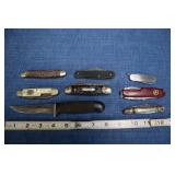 Several Pocket Knives And One Fixed Blade In Old