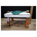 camel saddle foot stool, seeing eye motif