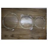 Three Pyrex Round Lids.