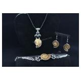 Ammonite Bracelet, Earrings, And Pendant On Black