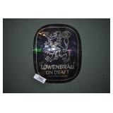 lowenbrau on draft sign.