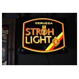 stroh light ligthed sign, cerveza.