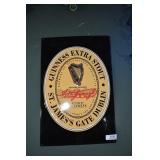 guinness extra stout sign. embossed tin.