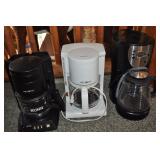 3 coffee pots, mr. coffee, old and dirty.