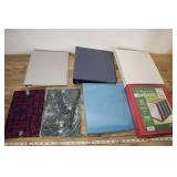 3 Ring Binders And Two Book Holders.