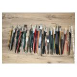 Large Assortment Of Paint Brushes.