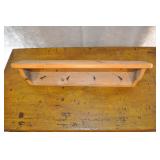 Wooden Coat Rack With Square Nails For Hooks.