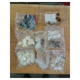 Assorted hardware, drawer slide supports, bolts.
