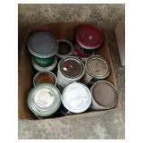 Assorted paint quarts, spackling paste.