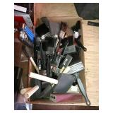 Box of paint and stain brushes. Some scrapers.