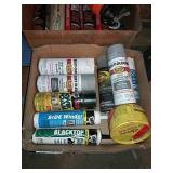 Assorted spray cans and caulk.