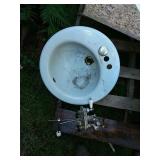Baby blue Koehler sink with faucet.