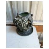 Clay vase sculpture.