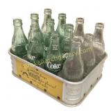 Vintage Coca-Cola Bottles and Metal Carrier