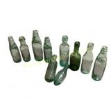 10 Glass Bottles With Embossed Text