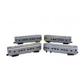 Four IlluminatedLionel Passenger Cars