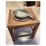Metal Porthole on Wooden Display Table