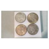 Four 1922 Peace Silver Dollars