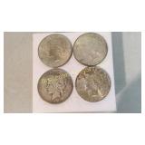 Four 1923 Peace Silver Dollars