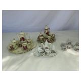 MINIATURE PORCELAIN TEA SETS (4)