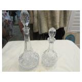 2 pressed glass decanters (tallest approx. 16")