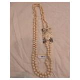 Chinese imitation ivory bead and figural pendant Chinese imitation ivory bead and figural pendant