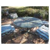 Metal patio table, 5 mismatched patio chairs