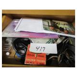 Contents of cupboard: office supplies, sunglasses