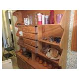 Contents of cupboard: vintage candles, vase,