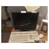 Dell monitor, keyboard, office chair, desk