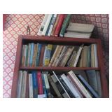 Books on 2 shelves +top: bees, psych, apes,
