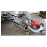 Honda self propelled push mower 23" w/ bagger;