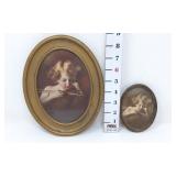 (2) "Cupid Asleep" Oval Framed Pictures